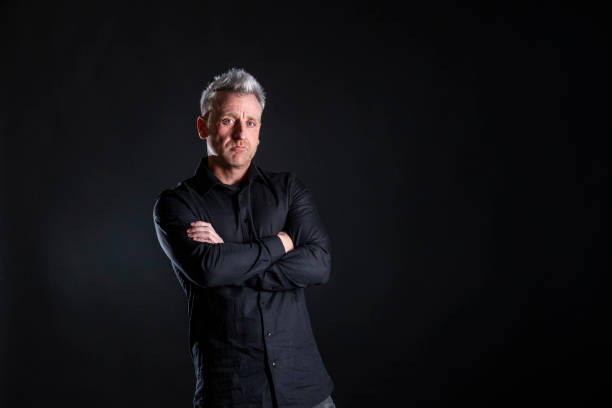 istock Middle-aged man dressed in black shirt and black jeans 1927065623