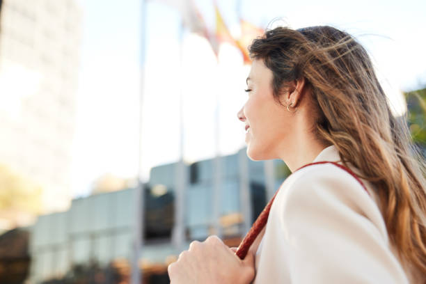 istock Street Perspective: Fast-Walking Businesswoman in Low Angle, Seen from Behind 1927073480