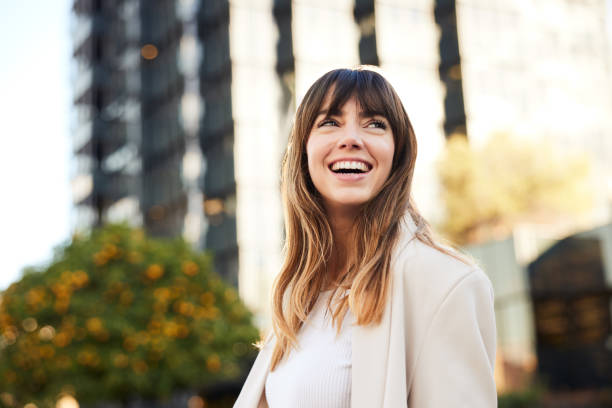 Afternoon Commuting: Young Professional Walks, Looking Back with a Broad Smile.