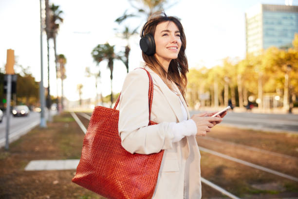 Thoughtful Stride: Young Professional Listens to Podcast on City Commute.
