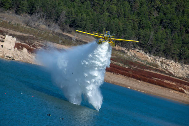 istock small planes and helicopters carrying out practices with swamp water 1927074674