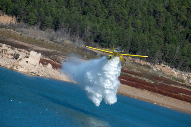 istock small planes and helicopters carrying out practices with swamp water 1927074678