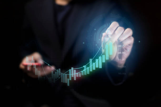 istock Businessmen work with stock market investments using computer and tablets to analyze trading data. smartphone with stock exchange graph on screen. Financial stock market. 1927079505