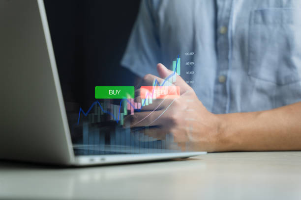 istock Businessmen work with stock market investments using computer and tablets to analyze trading data. smartphone with stock exchange graph on screen. Financial stock market. 1927081646