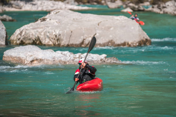 istock Young Adult Male Kayaker Navigating River Rapids 1927107600