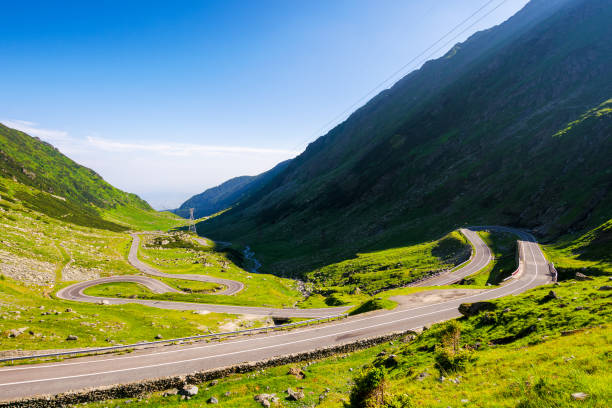 istock transfagarasan road winding through the green valley 1927117573