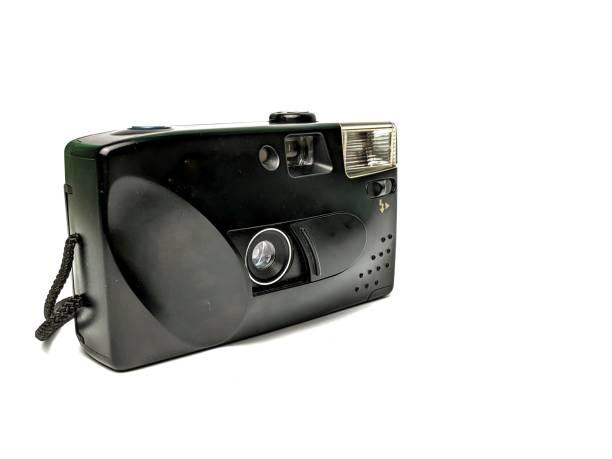 istock An old analog camera, using film tape, isolated on a white background 1927117602