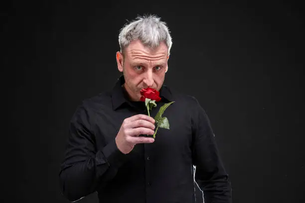 Photo of man gives a rose