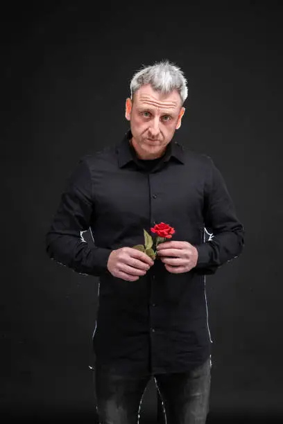 Photo of man gives a rose