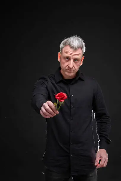 Photo of man gives a rose