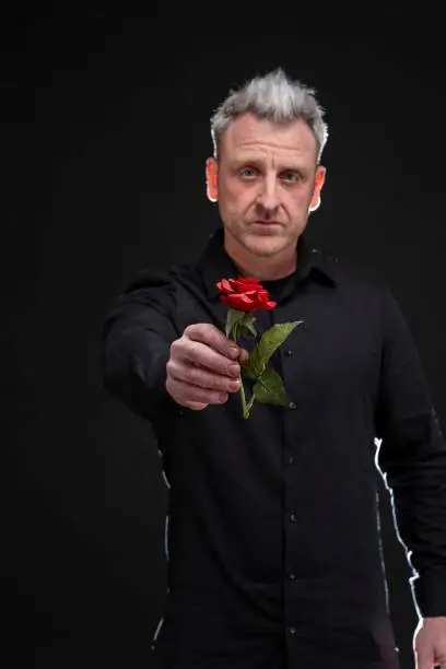 Photo of man gives a rose