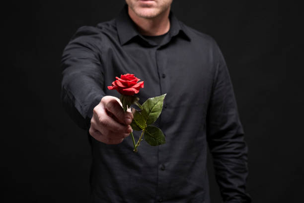 istock man gives a rose 1927124446