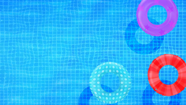 istock Swim rings on swimming pool water background. Inflatable rubber toy. Realistic summertime illustration. Summer vacation or trip safety item. Top view swimming circles. 1927124723