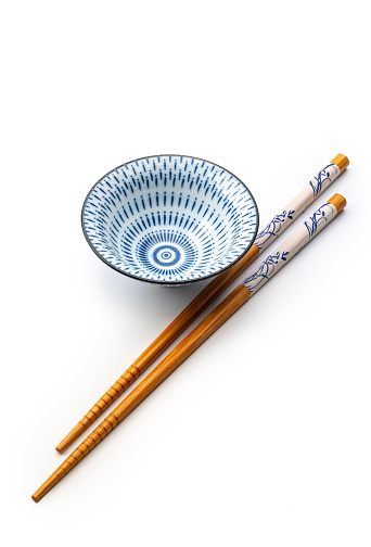 chopsticks and bowl shot in studio isolated on a white background, high angle view, studio shot.