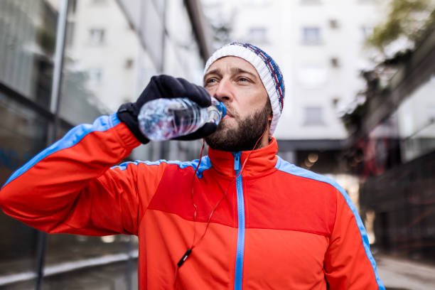 istock Young Man Exercising in the City Hydrating 1927155140