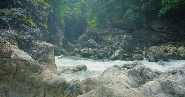 istock Evaporation over a cold mountain river with clear water in rocky gorge 1927161492