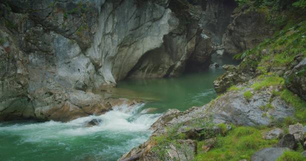 istock Clear water of river flow in rocky 1927166839