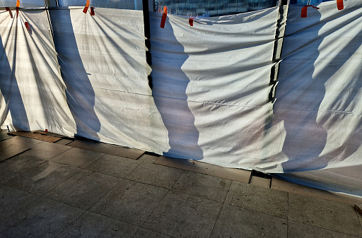 glass protection in the shopping center during construction and reconstruction, the windows are sealed with textile fabric. does not occur from paint splashes and absorbs impacts, geotextile