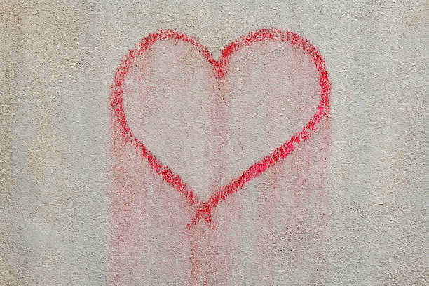 istock a red heart painted on a wall 1927193829