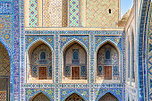 Decorated gallery with dormitory cells. Ulugh Beg Madrasah. Registan square, Samarkand, Uzbekistan