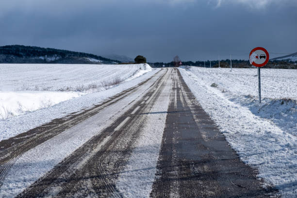 istock road covered by snow and ice after snowfall 1927223426