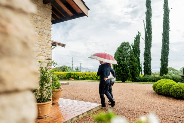 Mature couple arriving at hotel