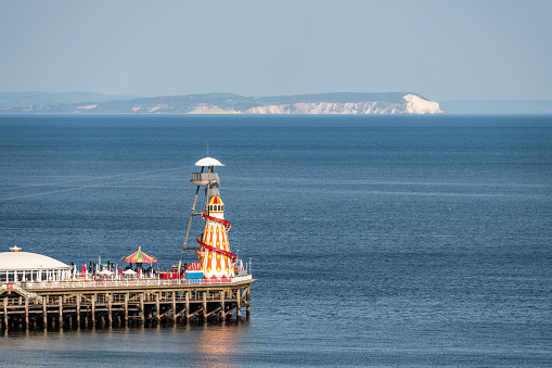 Rides on Bournemouth Pier with Isle of Wight in the distance
