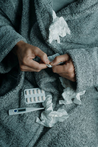 istock ill caucasian man at home is about to take a pill 1927245325