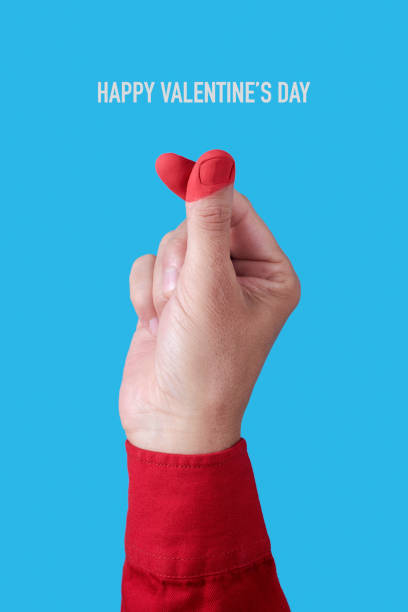 istock finger heart gesture and text happy valentines day 1927246948