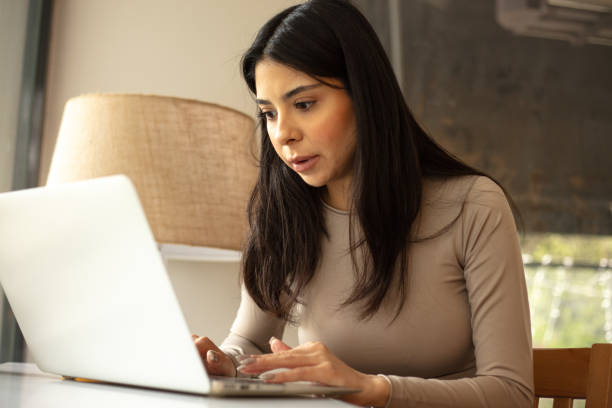 istock Young woman is working at coffee shop. 1927287299
