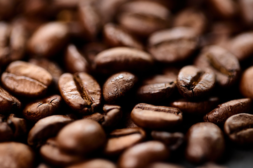 Close up of roasted coffee beans background.