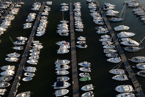 aerial view of a group of barges transporting oil and gas on the major rivers