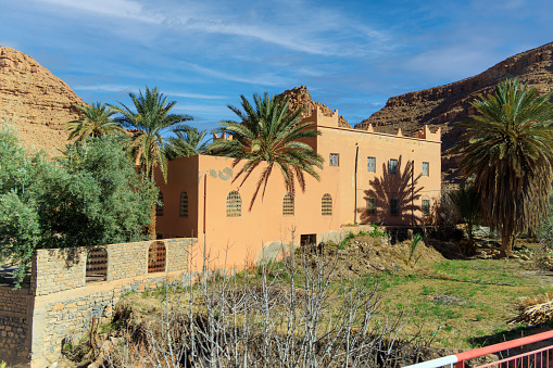 Aoufous, Morocco - Traditional muddy houses by palm oasis around river Ziz