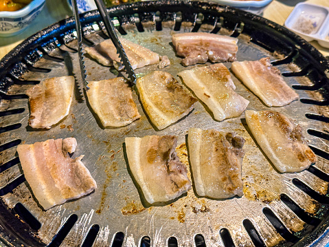 Closeup view of Korean food grill meant on table.