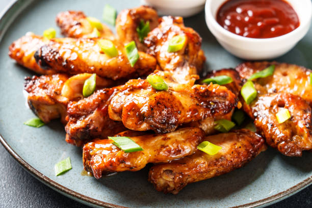 istock Chicken wings in bbq sauce grilled . 1927366990