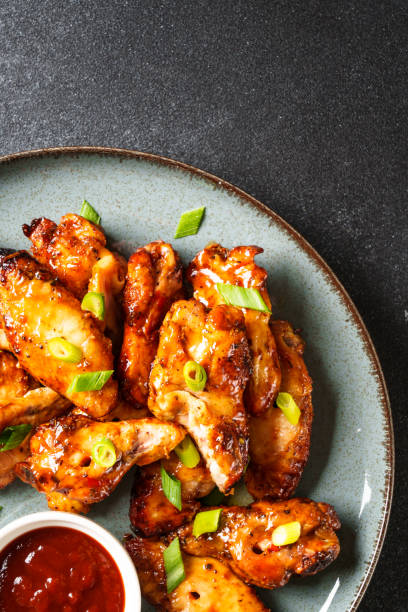 istock Chicken wings in bbq sauce grilled . 1927366991