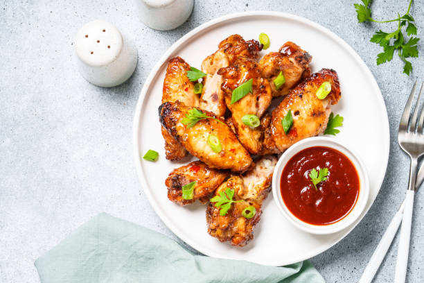 istock Chicken wings in bbq sauce grilled . 1927367519
