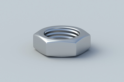 Metal nut on gray background. Construction materials. Industrial equipment. Tools in the workshop. 3d render