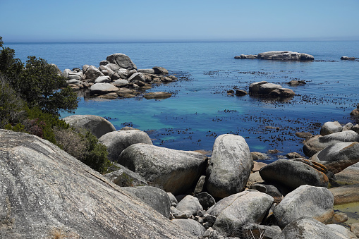 Granite boulders in the ocean in Cape Town South Africa