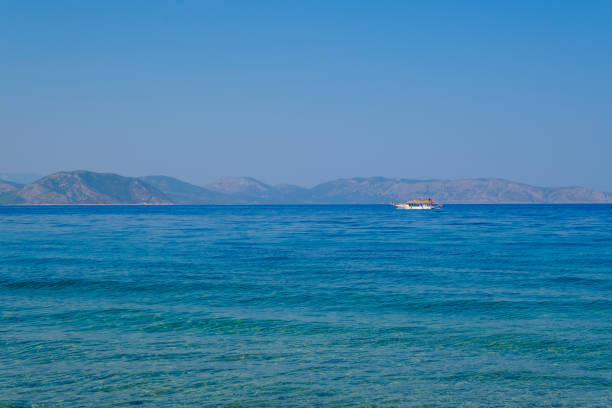 A ship is traveling in the Aegean Sea, Dilek Peninsula National Park, Aydin