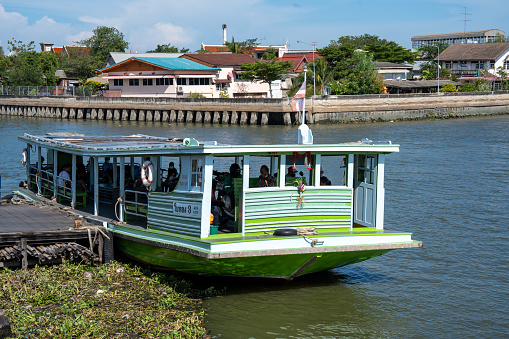 The ferry station is located near the famous Mahachai Seafood Market in Samut Sakhon, Thailand.\nThese ferry boats transport passengers and their scooters from one side of the river to the other several times a day.\nSamut Sakhon in Thailand Asia\n01/11/2024