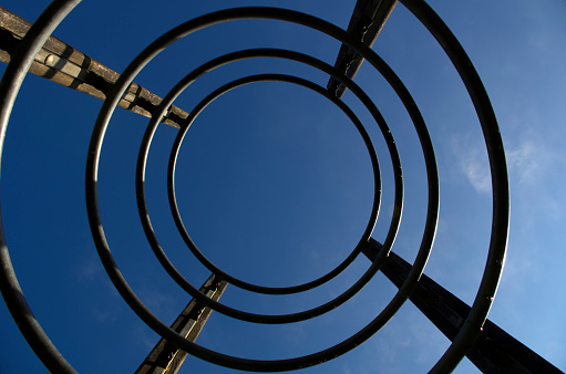 bottom view of metal hoops in a playground