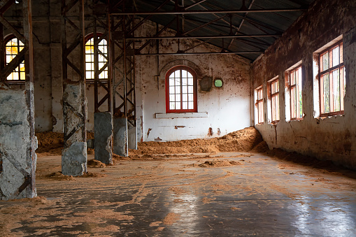 Old broken empty abandoned industrial building interior.