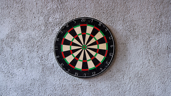 dart board attached on concrete wall