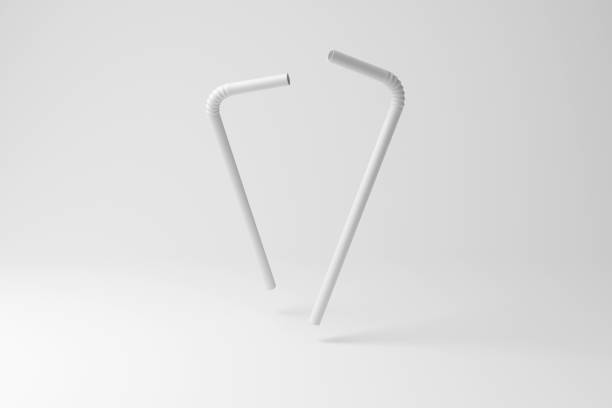 istock White plastic drinking straws floating in mid air on white background in monochrome and minimalism. Illustration of the concept of microplastics in the ocean 1927560703