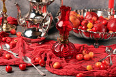 Still life in red tones, vintage style, Valentine's Day celebration, oil lamp, seduction, postcard, vintage, antique silver, castle