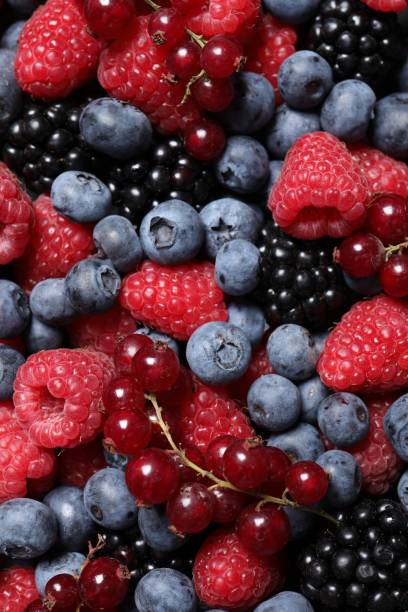 istock Assortment of fresh ripe berries as background, top view 1927614980