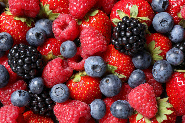 istock Assortment of fresh ripe berries as background, top view 1927631549