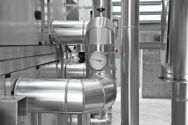 Hvac pipes, heating, ventilation, air conditioning and cooling system, ducted through the wall located outside. Climate system for the room comfort of the building. Pressure gauges, manometer and taps