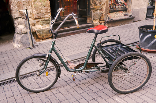 Vintage adult tricycle bike: A classic three-wheeled bicycle with timeless charm, evoking nostalgia and showcasing the enduring elegance of a bygone era